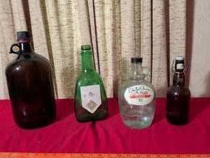lot 401 image: Lot of 4 Glass Bottles Carlo Rossi Sangria and Beer Bottles