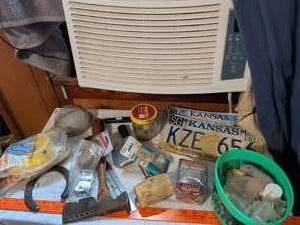 lot 496 image: Lot of miscellaneous items including window AC unit, license plates, hardware, electrical cable, and tools