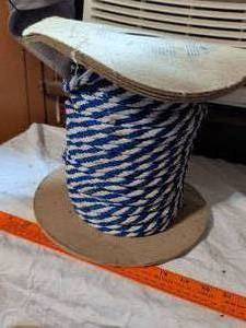 lot 500 image: Rope Spool Blue and White Striped Twisted Cord on Wooden Base