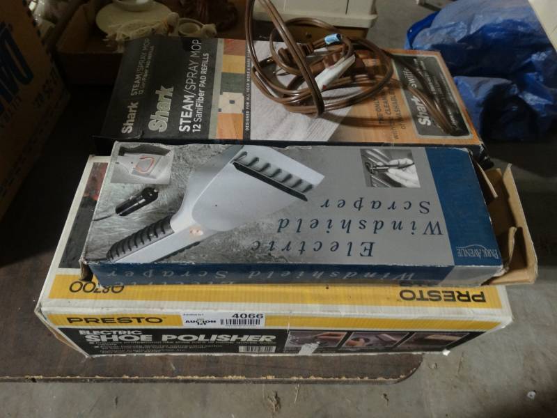 lot 4066 image: Shoe polisher, cord, electric windshield scrapper, a Pad refill for a shark steam mop and cassette tapes.