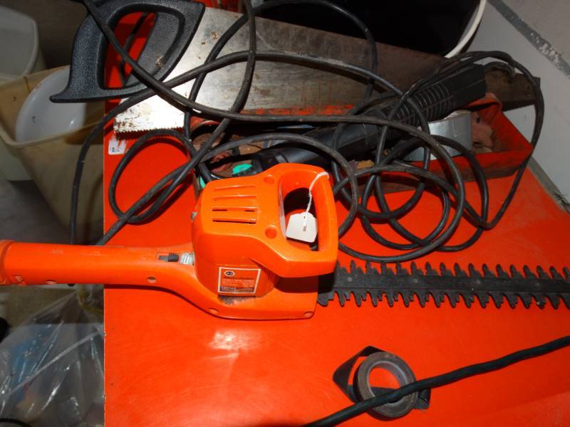 lot 4143 image: Black and decker shrub & hedge trimmer. Hand saw. Work light and tool box.