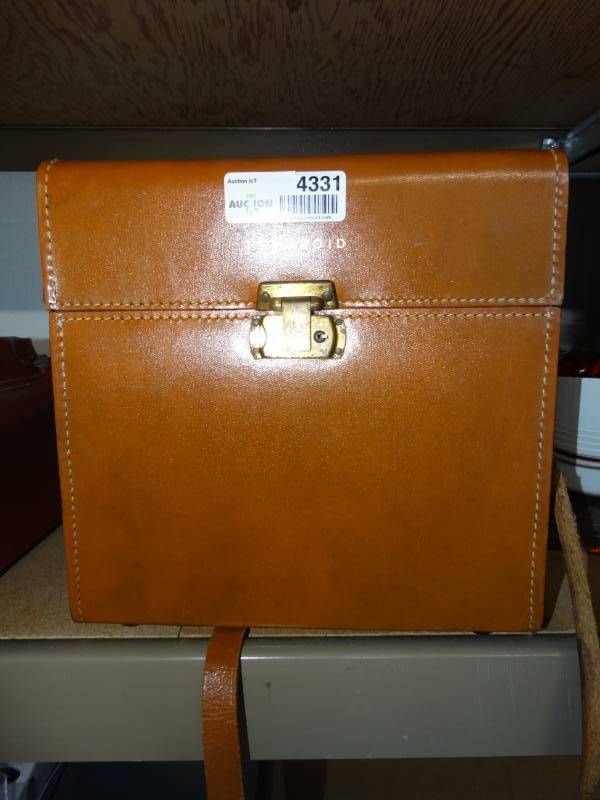 lot 4331 image: Polaroid camera bag w a Polaroid Land camera Model 150 and the 800