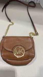 lot 1006 image: Michael Kors MK Circle Logo Brown Leather Crossbody Bag