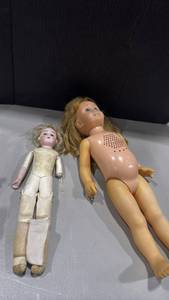 lot 1043 image: Vintage Chatty Cathy doll and German bisque head doll with a leather or kidoline body arm needs reattached