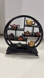 lot 1044 image: Wooden display shelf with tiny teapots 10x9x2