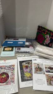 lot 1134 image: Quilting patterns and kits, fabric and completed project