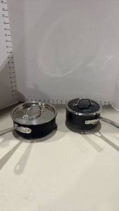 lot 1246 image: Calphalon 1.5 qt sauce pan and All clad 2 qt sauce pan