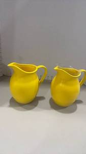 lot 1256 image: Yellow ceramic pitchersflower vases