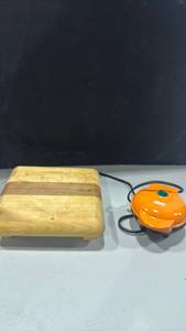 lot 1287 image: Dash D2 Mini Waffle Maker Orange with Wooden Trivet
