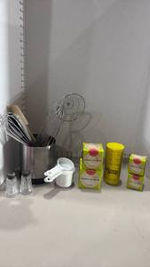 lot 1291 image: Kitchen Utensil Lot Whisks, Measuring Cups, Parchment Paper for cupcake pan and more