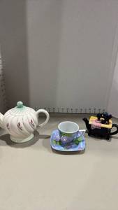 lot 1334 image: Ceramic Teapot with Floral Design, sewing machine shaped teapot  and Matching Cup Saucer Set