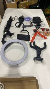 lot 2002 image: Phone tripods, ring light, charging station and more