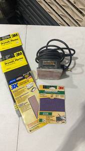 lot 2011 image: Black & Decker sander and sandpaper