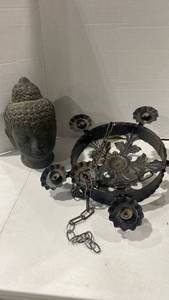 lot 2047 image: Terra cotta Buddha head and hanging metal candlelabra