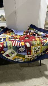lot 2131 image: Pottery Barn quilted tree skirt 59in diameter approx with small velvet and sequin tree skirt