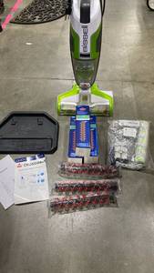 lot 2313 image: Bissell Crosswave with stand and extra supplies