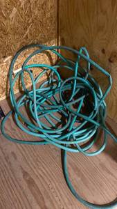 lot 2323 image: Two garden hoses, unknown sizes