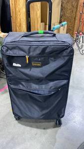 lot 2330 image: Large rolling suitcase by Lucas