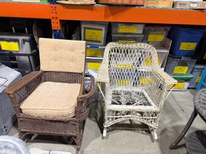 lot 205 image: Wicker rocker with magazine holder and other wicker rocker (no seat cushion) (both fairly heavy)