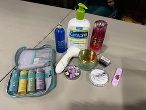 lot 2226 image: Scentered therapy balms in case, lotions and Tokidoki compact mirror