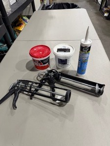 lot 2028 image: Caulk guns, grout, sealant and joint compound