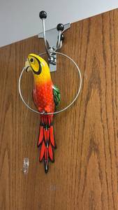 lot 909 image: Hand painted ceramic parrot on 8 in tall perch