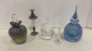 lot 1032 image: Blue Speckled Glass Perfume Bottle with Teardrop Stopper and other Perfume Bottles