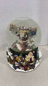 lot 1103 image: Snow Globe with Music Box Here Comes Santa Clause 8 Inch
