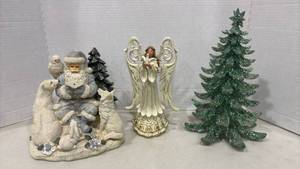 lot 1106 image: Holiday Angel  Figurine, Santa Reading Figurine and Glitter Tree. Tallest item 12 inch