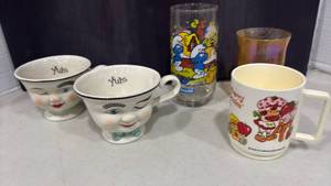 lot 1151 image: Vtg Baileys, Strawberry Shortcake with Smurf Glass and more