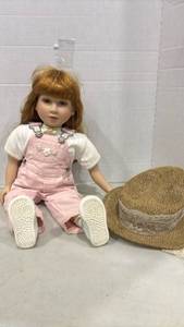 lot 1186 image: Porcelain Doll with Golden Hair Pink Overalls White Shoes 23 inches