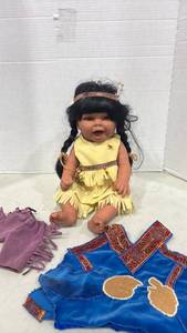lot 1191 image: Doll with Black Hair Yellow Dress Headband and Extra Clothing