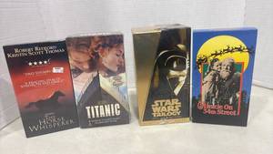 lot 1202 image: Lot of 4 DVDs The Horse Whisperer, Titanic, Star Wars Trilogy Special Edition, Miracle on 34th Street