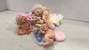 lot 1212 image: Small Baby Dolls with Wings and Accessories