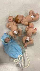 lot 1213 image: Lot of 5 Baby Dolls with Blue Swaddle Blanket