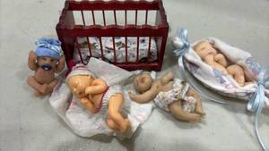 lot 1214 image: Miniature Baby Dolls with 4 inch  Crib and Accessories