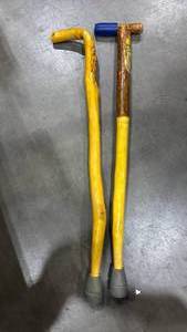 lot 1259 image: 2 Yellow Handled Curved and Straight Mountain Man Carved Cane
