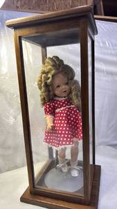 lot 2001 image: Early Shirley Temple Doll in Display 24x11x11