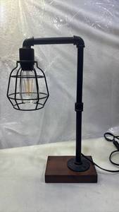 lot 2021 image: Black Pipe Table Lamp with Wire Cage Shade and Wood Base 19 inches tall