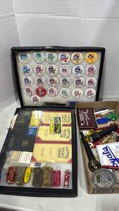 lot 2076 image: Prairie Oyster Festival Button Collection 30 Pins 1987-1996, Farmers Pocket Ledgers and more. Some  water damage to items. See pictures