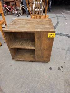 lot 25178 image: Rustic wooden side table features a warm natural finish with two convenient open shelves on one side.