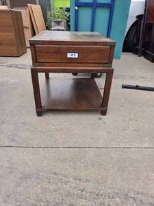 lot 02 image: Wooden End Table With One Drawer.