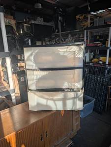 lot 137 image: 3-tier plastic storage drawer tower with translucent drawer and black frame.