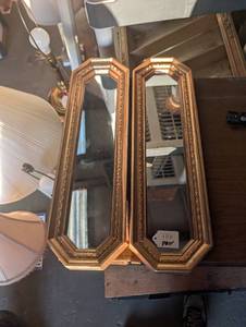 lot 141 image: Set of 2 Gold-toned narrow octagonal wall mirrors