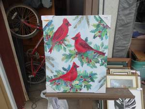 lot 55 image: Decorative holiday canvas print featuring three red cardinals perched on pine or holly branches against a light background
