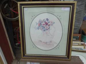 lot 59 image: Vintage framed floral print featuring a bouquet of pastel flowers in a white pitcher, matted in light green with an oval border