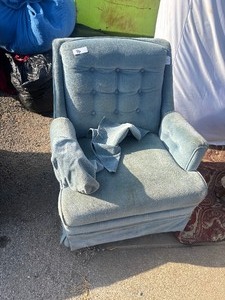 lot 96 image: Vintage light blue upholstered armchair featuring a tufted back and a skirted base