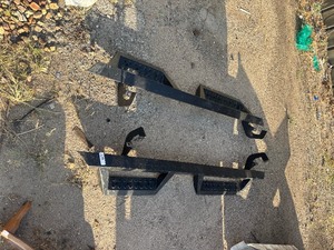 lot 119 image: Black steel drop-step running boardsside steps for a pickup truck.