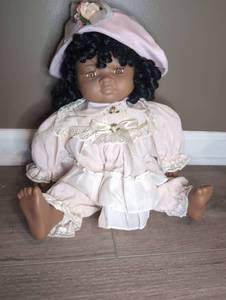 lot 800 image: Doll with Black Curled Hair Pink Outfit and Bonnet