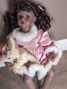 lot 806 image: Porcelain Doll with Black Curled Hair Pink Dress White Fur and Teddy Bear